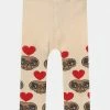 Mini Rodini E.T HEART UNISEX - Leggings - Trousers - Offwhite -Mini Rodini shop 35b7fbcaa710442d98d940fc0833db4d